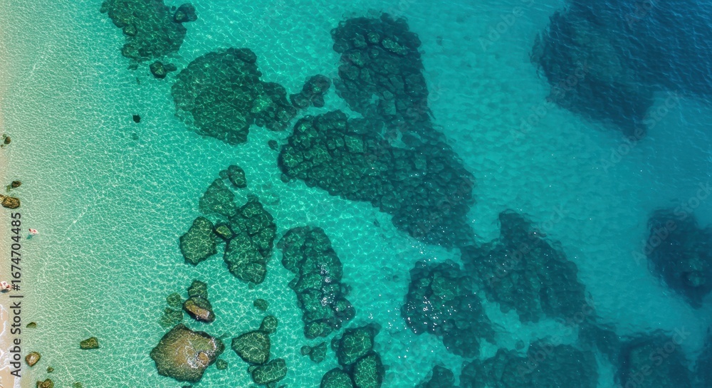 Naklejka premium Aerial Top-Down View of a Crystal Clear Turquoise Sea