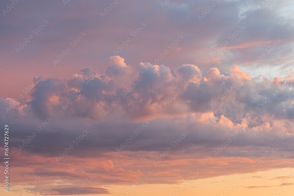 Fototapeta premium Orange, pink, purple skyscape at dusk or dawn, no horizon line, upward perspective, soft focus, pastel tones, realistic style, tranquil atmosphere
