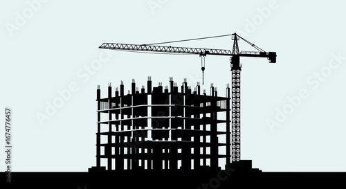 Silhouette of a Building Under Construction with Tower Crane