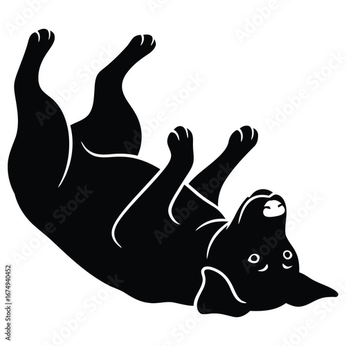 A happy black dog rolls over on its back, enjoying playtime with a playful and joyful expression