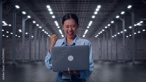 Wallpaper Mural Asian Female With Her Laptop in Empty Modern Warehouse, She Raises Her Fist Up With Screaming Goal Torontodigital.ca