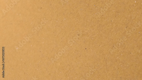 Background of brown kraft paper or cardboard texture. copy space background in beige yellow, brown.
