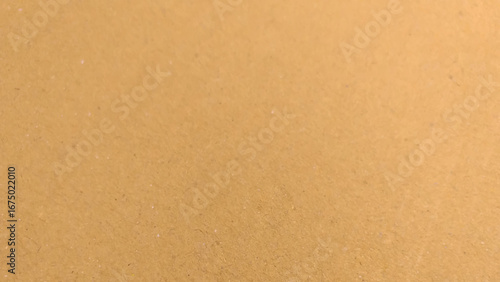 Background of brown kraft paper or cardboard texture. Abstract pattern of beige rough carton, old paper sheet.