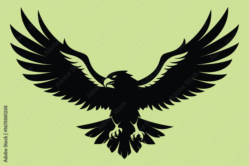 Obraz premium Powerful black eagle silhouette soaring with wings spread wide against a serene light green background