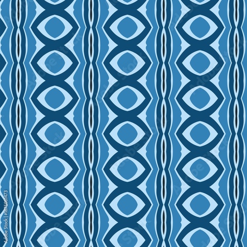 This seamless geometric pattern features abstract vertical stripes of stacked, wavy oval motifs, creating a bold ethnic design in a monochromatic blue palette
