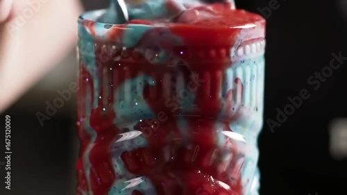 Vibrant layered smoothie in decorative glass