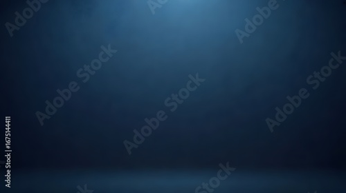 Mysterious dark blue studio background with subtle spotlight creating an atmospheric and dramatic effect for product showcases or creative projects.