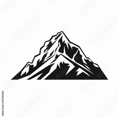 Majestic alpine peak with sharp slopes and jagged mountain range silhouette