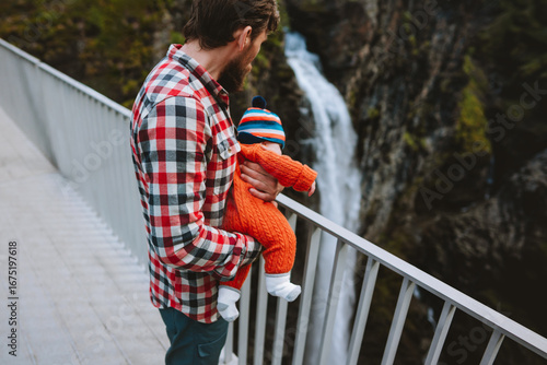 Фототапет Family vacations travel in Norway dad and baby hiking together, sightseeing wate