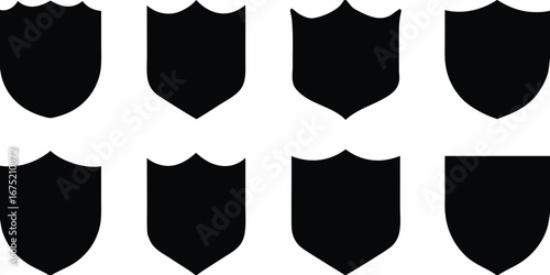 Collection of eight black shield shapes with varied crests and points on a white background