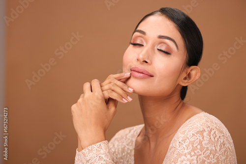Fotografie Young Woman Tenderly Touching Her Soft Skin