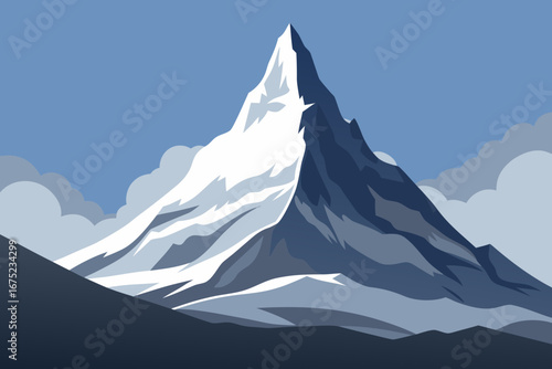 Majestic snow covered mountain peak under a blue sky