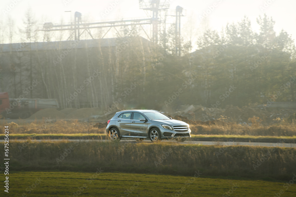 Fototapeta premium Vehicle driving through countryside scenery