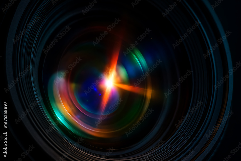 Obraz premium Colorful close-up of a camera lens reflecting light flares, showcasing optical glass layers, vibrant spectrum, and professional photography design.