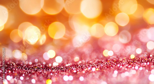 Abstract luxury bokeh background in pink and gold tones with glowing glitter lights. 