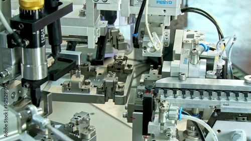 Advanced robotic systems operate within a manufacturing assembly line, demonstrating efficient mechanical processes and automation techniques.