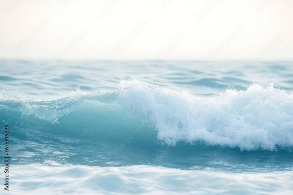 Obraz premium Gentle ocean waves rolling under soft light creating a calm and peaceful seascape