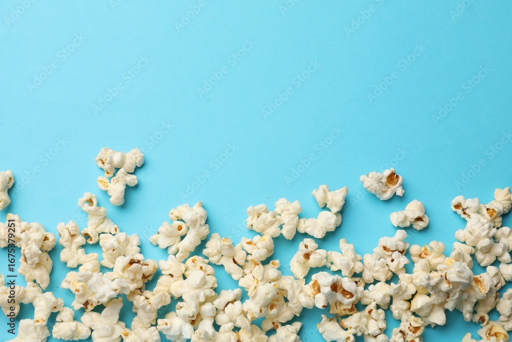 custom made wallpaper toronto digitalTasty popcorn on light blue background, flat lay. Space for text
