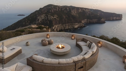 Luxury terrace on a rocky coast with sea view at sunset