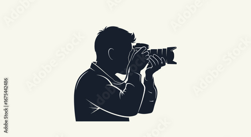 Silhouette of a man taking a photo with a camera against a plain background.