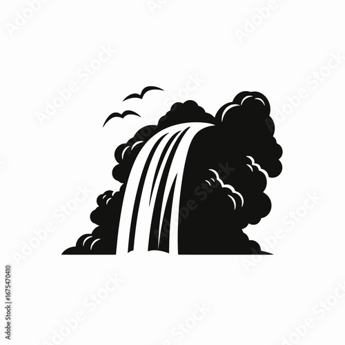 Dramatic waterfall cascades between dark cliffs in black and white silhouette