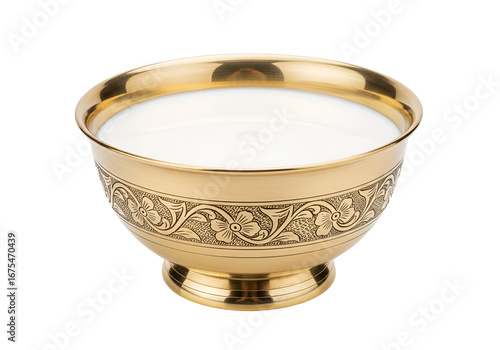 Ornate golden bowl filled with creamy white liquid, showcasing detailed floral engravings.