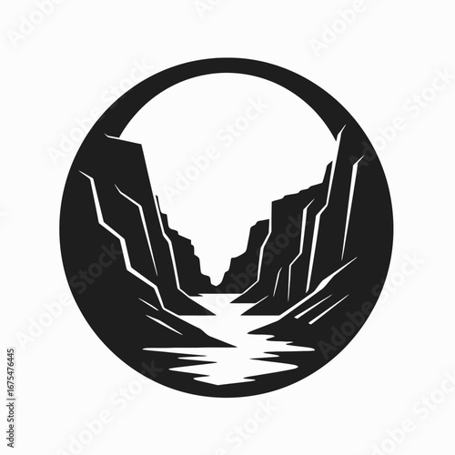 Black canyon framed with a circle, creating a dramatic landscape silhouette