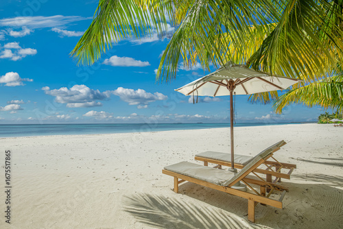 Fototapeta Naklejka Na Ścianę i Meble -  Peaceful summer sunny landscape with beach chairs and umbrella under tropical palm leaves, stunning luxury vacation scenery, relaxing ocean view, exotic travel destination, perfect tropical getaway ba