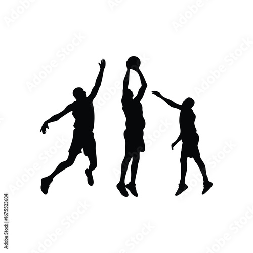 Basketball players silhouetted in action during a game