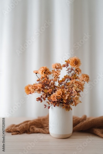 A vase of autumn flowers, pastel colors with an accent on orange, bouquet of chrysanthemums, field plants, autumn flowers, aesthetic, instagrammable, beautiful fall photo. For social media posts