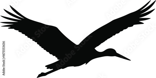 Silhouette of a stork in flight against a bright sky vector