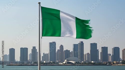 Nigerian Flag Waving Proudly Over City Skyline Waterside View