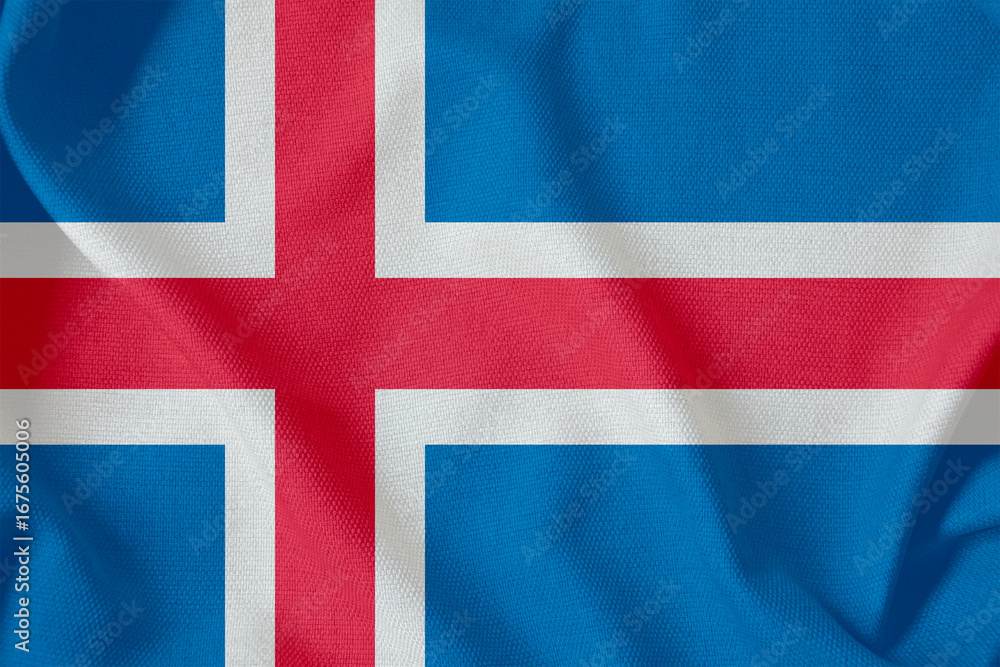 Fototapeta premium blue flag of the Republic of Iceland with a red Scandinavian cross on a rough canvas with folds