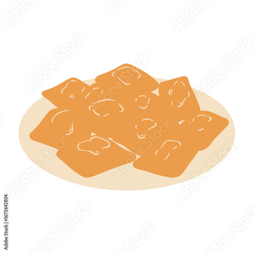 A plate of golden-brown, square pastries, topped with a light yellow glaze, is displayed in an appetizing arrangement.