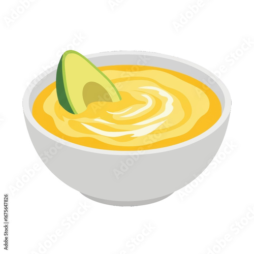 A bowl of creamy, vibrant yellow soup, enhanced by a slice of avocado, rests on a plain background.