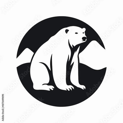 Dramatic polar bear against mountainous backdrop creates a stunning graphic silhouette