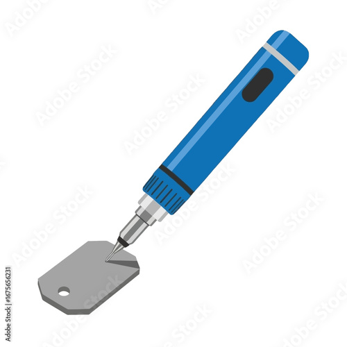 A blue pen-like tool is positioned above and slightly angled to a gray metal tag.