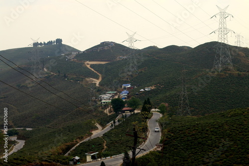 Mirik, India-December 24, 2017: Serpentine roads carressing the hill in Darjeeling, India. On the way to Mirik, West Bengal India. Scenic beauty of tingling view point near Mirik.  