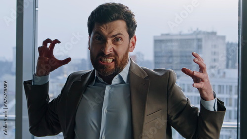 Photos Furious manager demonstrating madness at windows office portrait