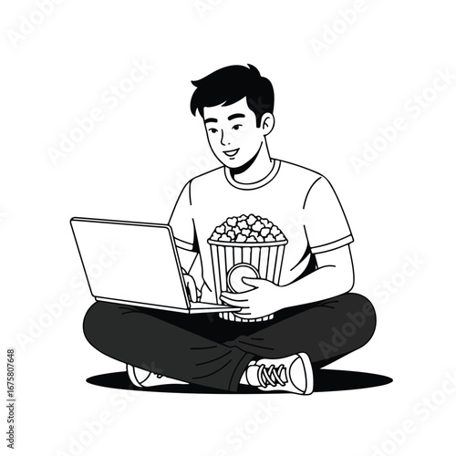 Smiling young man watching movie on laptop while sitting crosslegged with popcorn at home, enjoying a relaxing evening.