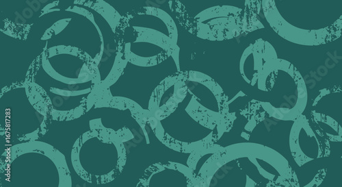 Grunge circles pattern on dark teal background creating a textured design