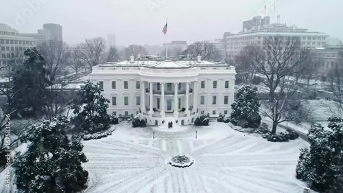 Aerial Top-down of White House, Washington DC. Snow falling in winter