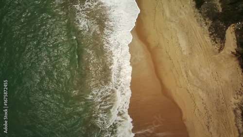 Aerial drone view of Coqueiros Beach with cliffs and ocean, João Pessoa, Paraíba, Brazil