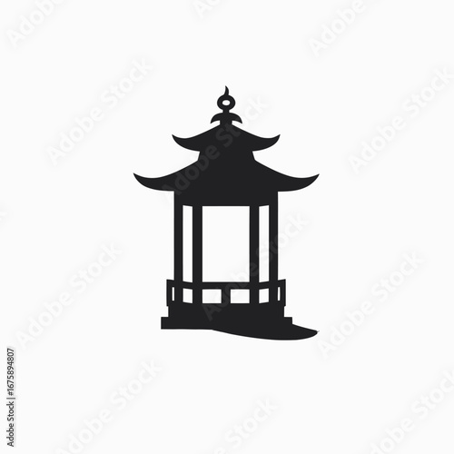 Ornamental architectural gazebo provides garden ambiance as a dark silhouette