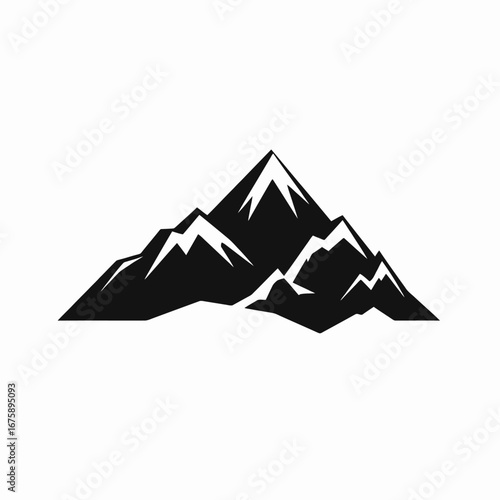 Majestic jagged peaks stand in stark black and white mountain range silhouette