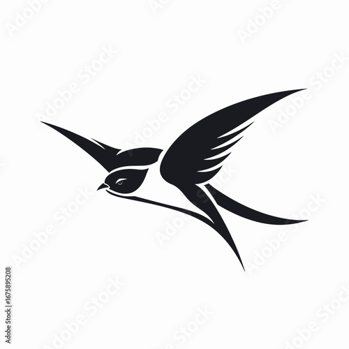 Striking black swallow soars through the air as a minimalist design silhouette