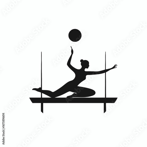 Elegant aerial gymnast poised with ball showcasing skill in dark silhouette