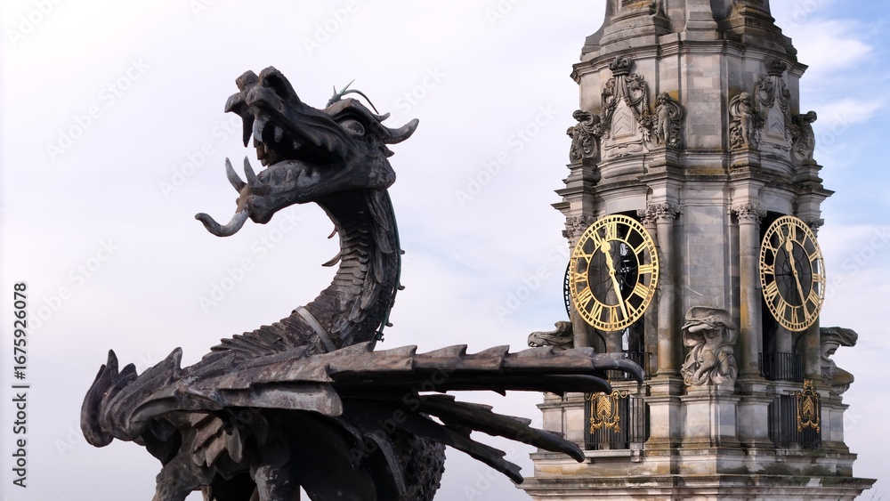 Fototapeta premium Cardiff dragon on the council building with clock in background