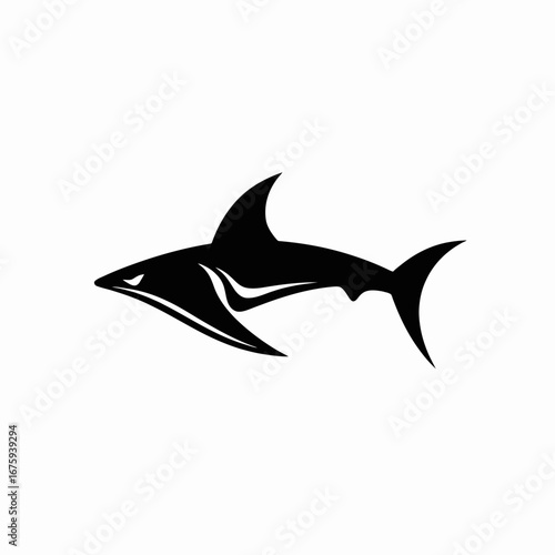 Powerful predatory shark swims menacingly across open water in black silhouette