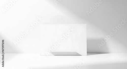 Wallpaper Mural Modern and Clean Minimalist White Studio Room Featuring a Simple Rectangular Display on a Bright White Floor, Accentuated by Elegant, Artistic Shadows from Natural Light Sources. Torontodigital.ca